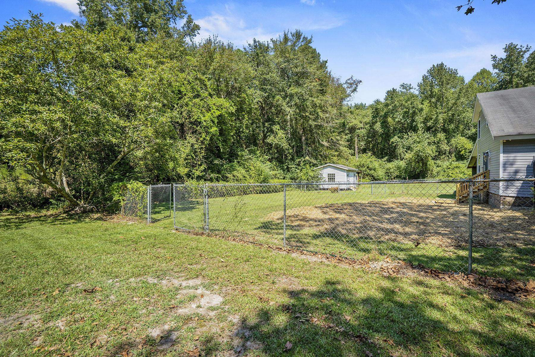 170 Temple Road Bunnlevel, NC 28323 - Photo 29 of 34 a backyard of a house with lots of green space