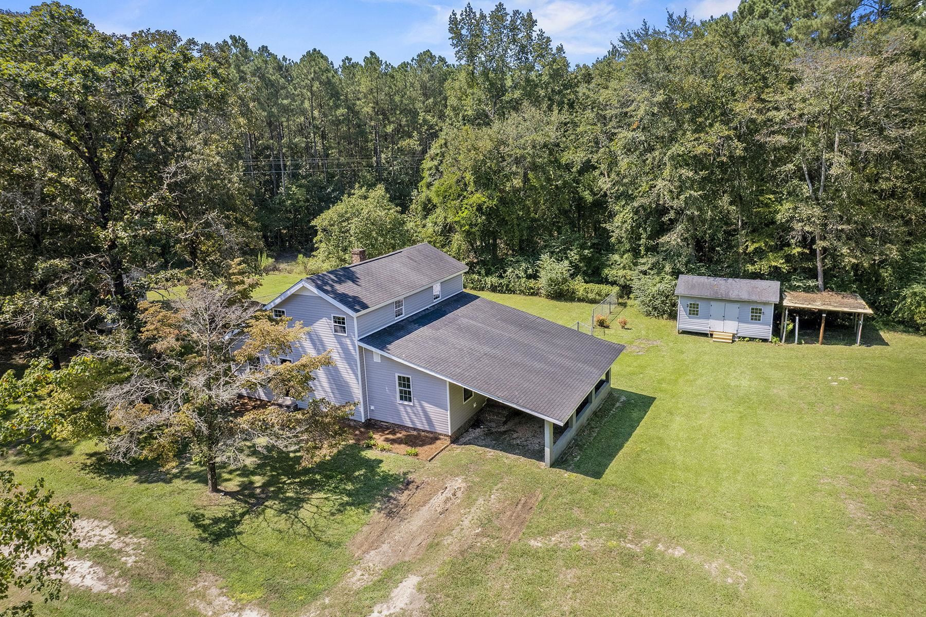 170 Temple Road Bunnlevel, NC 28323 - Photo 3 of 34 a view of a house with a yard and sitting area