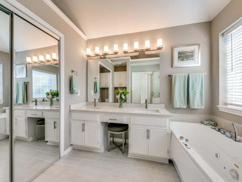 10805 Stone Canyon Road Dallas, TX 75230 - Photo 12 of 19 a spacious bathroom with a granite countertop sink and a large mirror