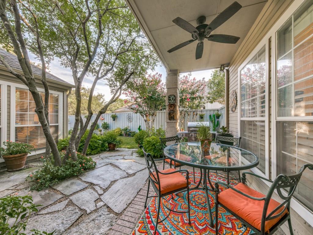 10805 Stone Canyon Road Dallas, TX 75230 - Photo 13 of 19 a patio with yard glass top table and chairs