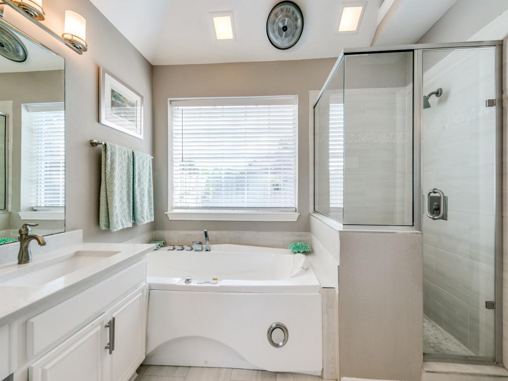 10805 Stone Canyon Road Dallas, TX 75230 - Photo 14 of 19 a bathroom with a sink and a mirror