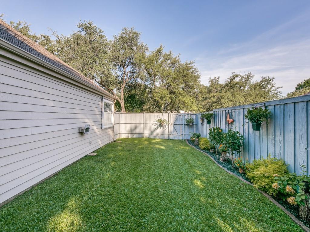 10805 Stone Canyon Road Dallas, TX 75230 - Photo 19 of 19 a backyard of a house with lots of green space
