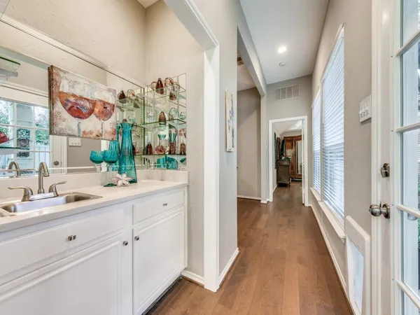 a en suite bathroom with a sink mirror and shower