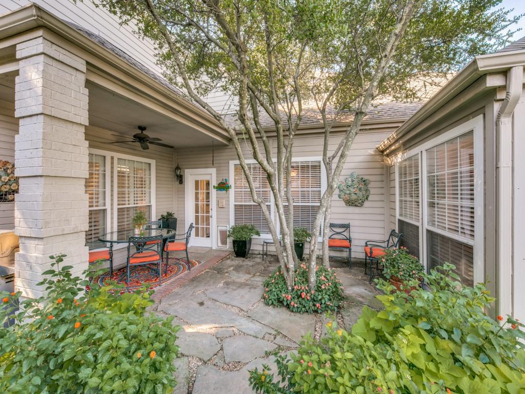 10805 Stone Canyon Road Dallas, TX 75230 - Photo 9 of 19 a view of a chair and table in backyard of the house