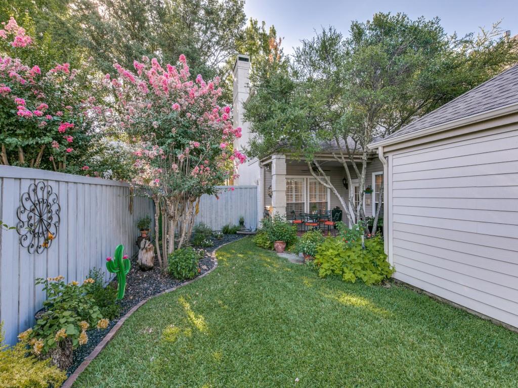 10805 Stone Canyon Road Dallas, TX 75230 - Photo 10 of 19 a front view of a house with garden