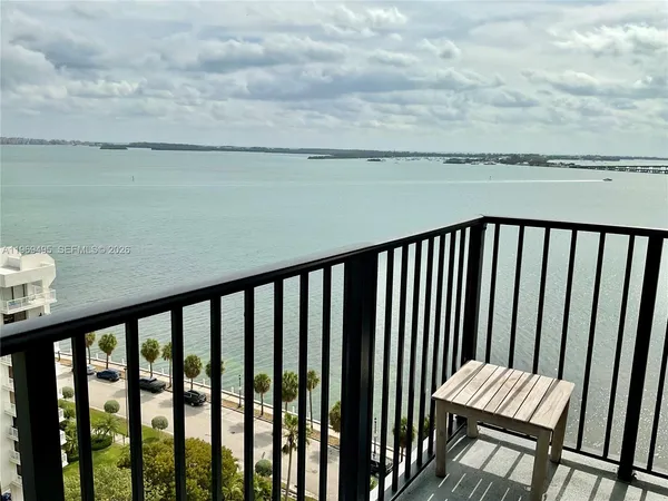 a view of a balcony with wooden floor