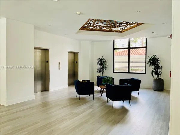 a bathroom with glass door shower and a mirror