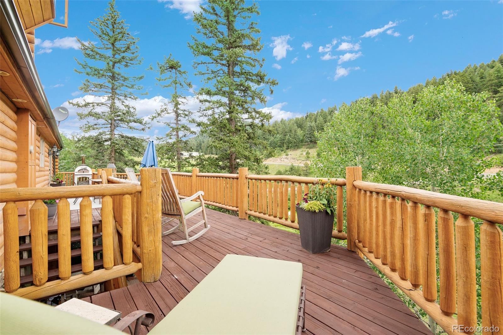 19114 Silver Ranch Road Conifer, CO 80433 - Photo 29 of 40 a view of a balcony with wooden floor