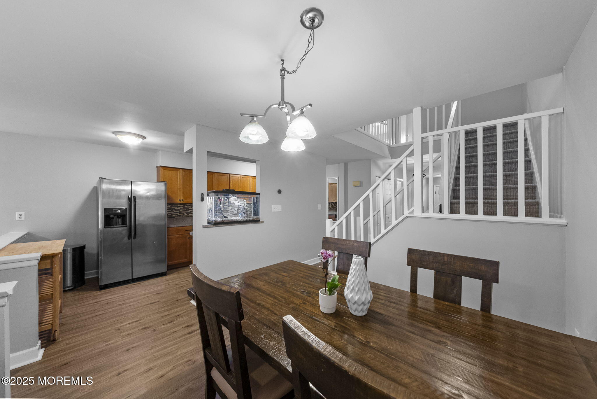 74 Lexington Circle Matawan, NJ 07747 - Photo 14 of 48 a view of a dining room with furniture and wooden floor