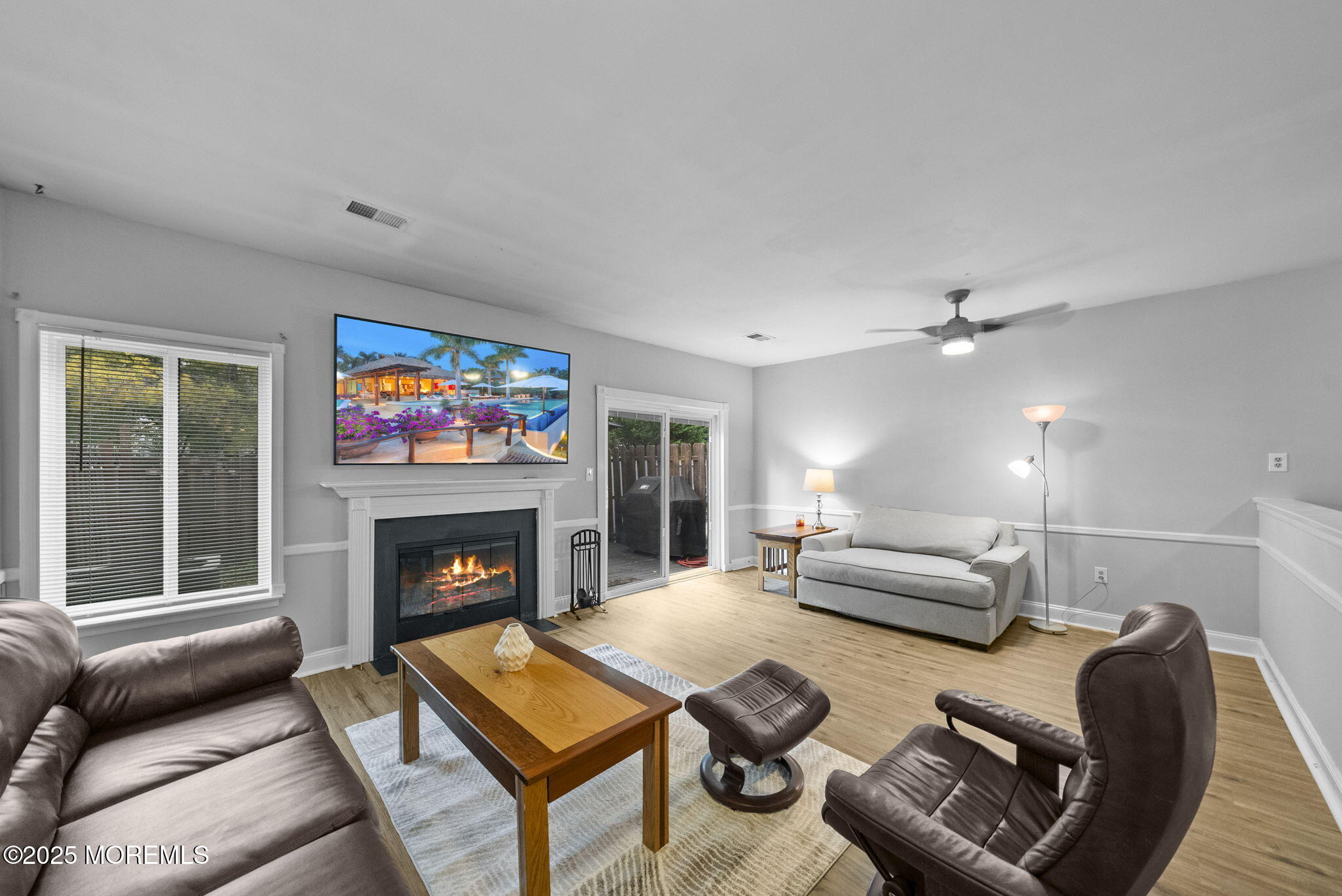 74 Lexington Circle Matawan, NJ 07747 - Photo 16 of 48 a living room with furniture and a fireplace