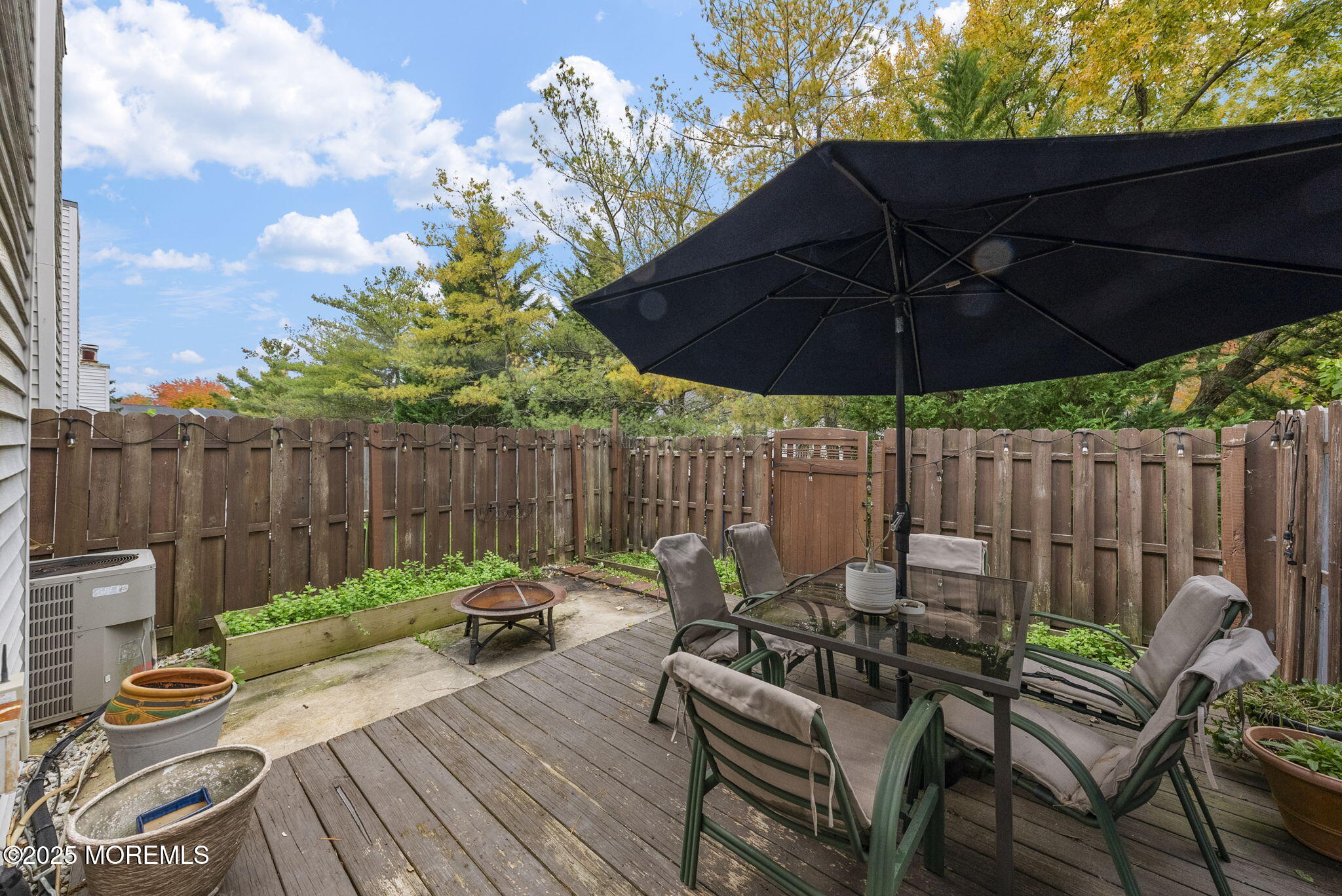 74 Lexington Circle Matawan, NJ 07747 - Photo 20 of 48 a view of a lounge chair on the roof deck