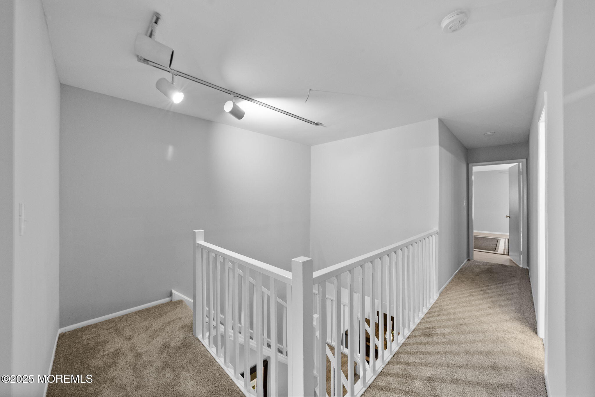74 Lexington Circle Matawan, NJ 07747 - Photo 24 of 48 a view of a hallway with wooden floor