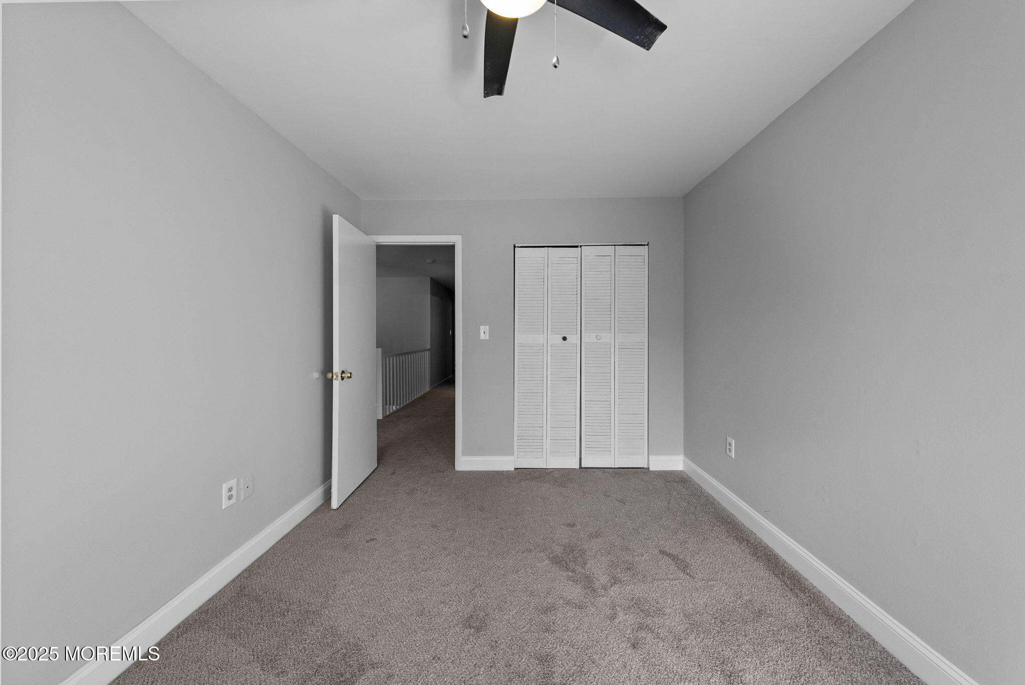 74 Lexington Circle Matawan, NJ 07747 - Photo 29 of 48 an empty room with chandelier fan