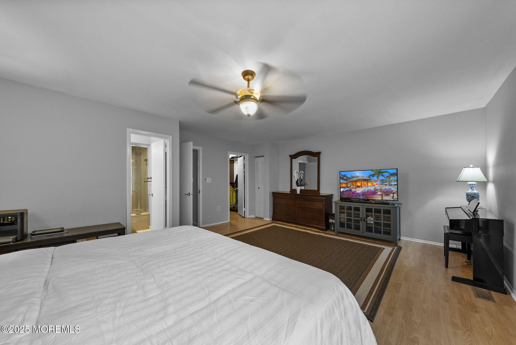 74 Lexington Circle Matawan, NJ 07747 - Photo 34 of 48 a bedroom with a bed and a flat screen tv