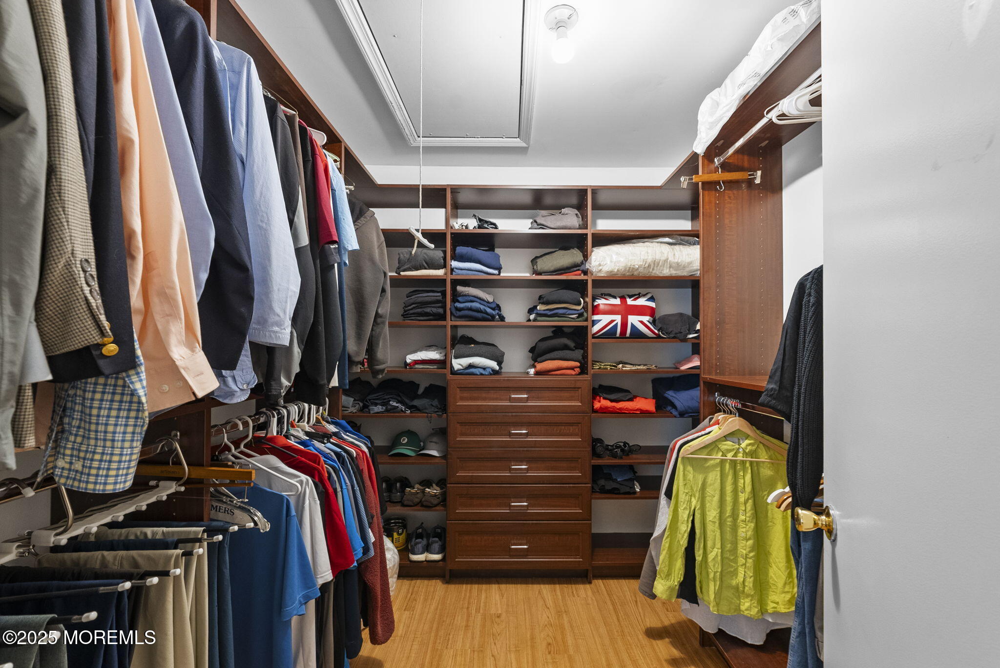 74 Lexington Circle Matawan, NJ 07747 - Photo 35 of 48 a view of walk in closet with clothes and shoes