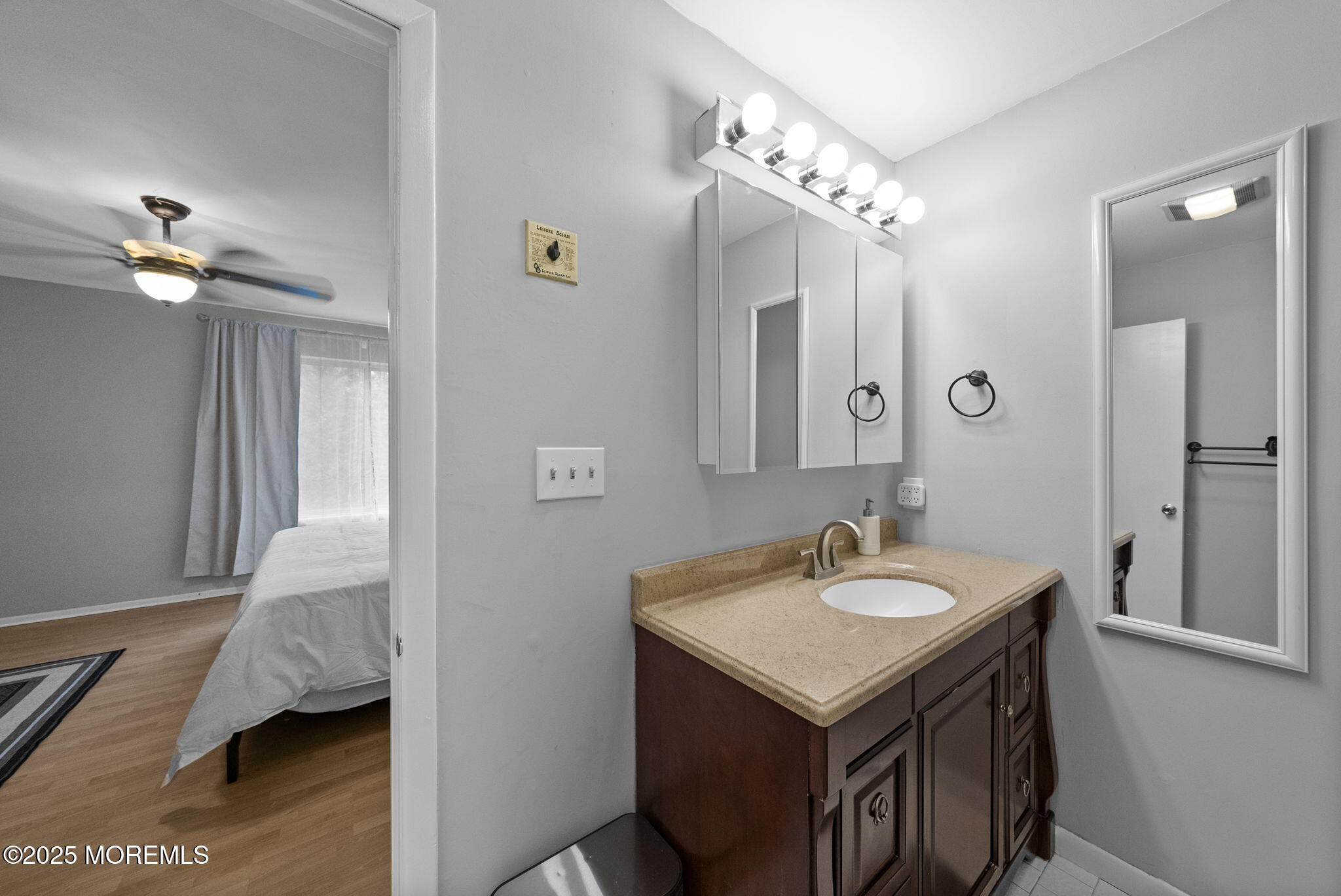 74 Lexington Circle Matawan, NJ 07747 - Photo 37 of 48 a bathroom with a sink and a mirror