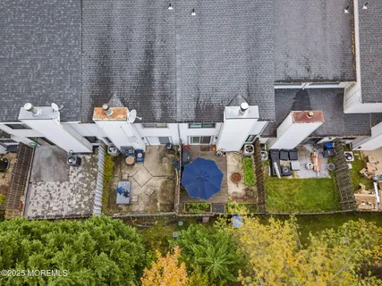 an aerial view of a house with outdoor space