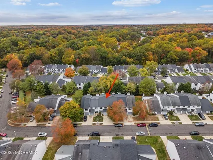 an aerial view of residential houses with outdoor space