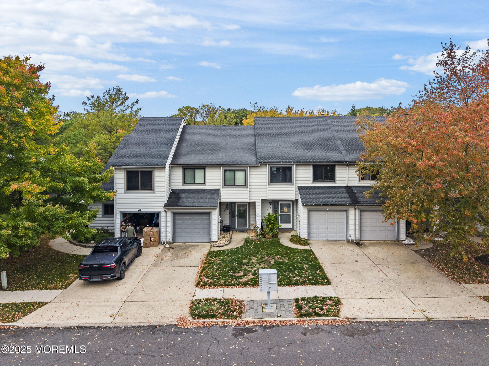 74 Lexington Circle Matawan, NJ 07747 - Photo 4 of 48 a front view of a house with a garden