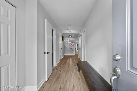 a view of a hallway view with wooden floor