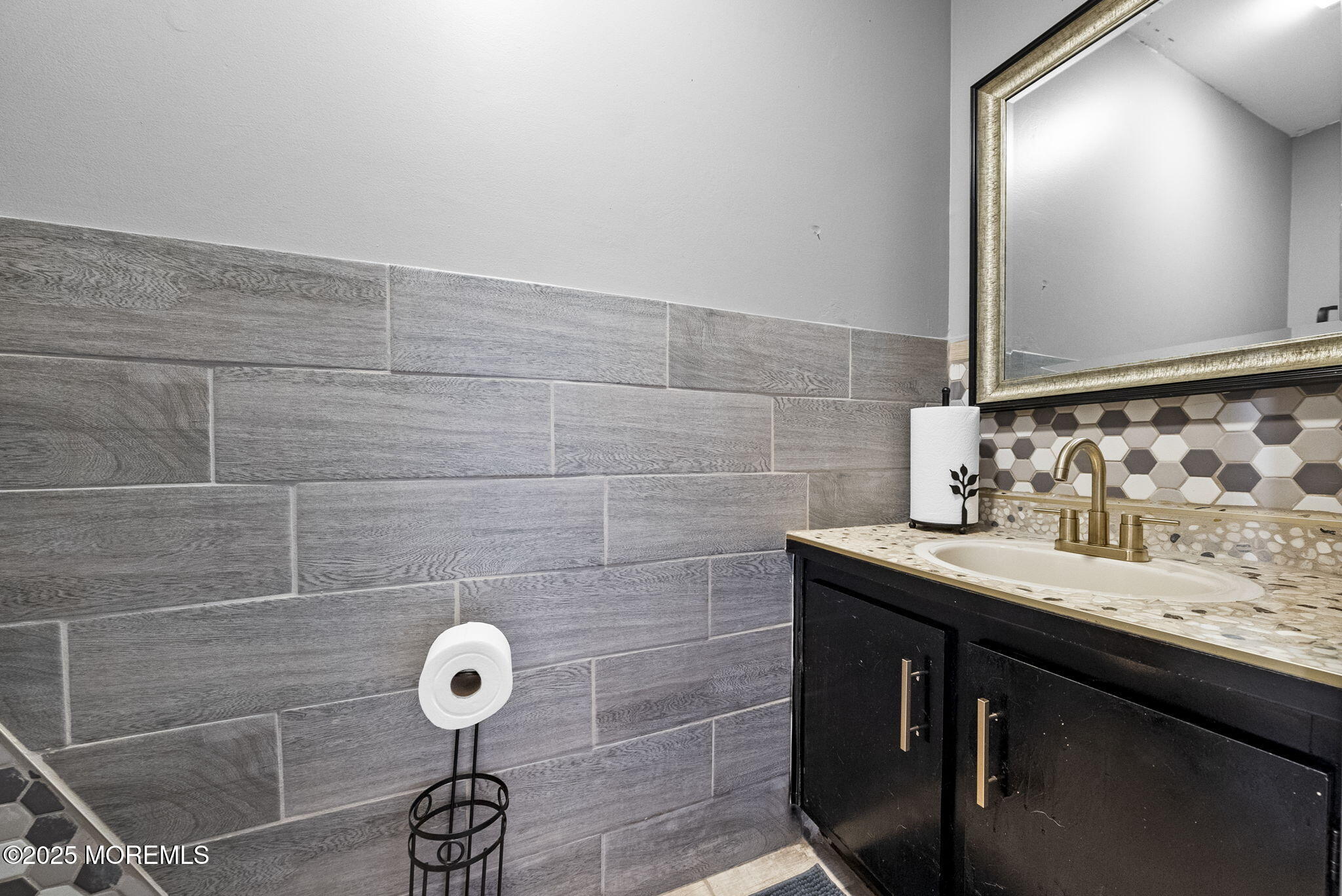 74 Lexington Circle Matawan, NJ 07747 - Photo 7 of 48 a bathroom with a granite countertop sink and a mirror
