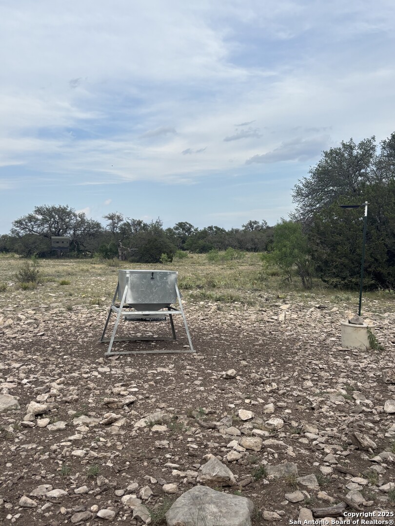 1085 Fallow Road Christoval, TX 76935 - Photo 16 of 26 a view of a lake with a big yard