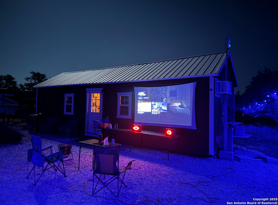 1085 Fallow Road Christoval, TX 76935 - Photo 25 of 26 a view of a livingroom with furniture a bookshelf and a potted plant
