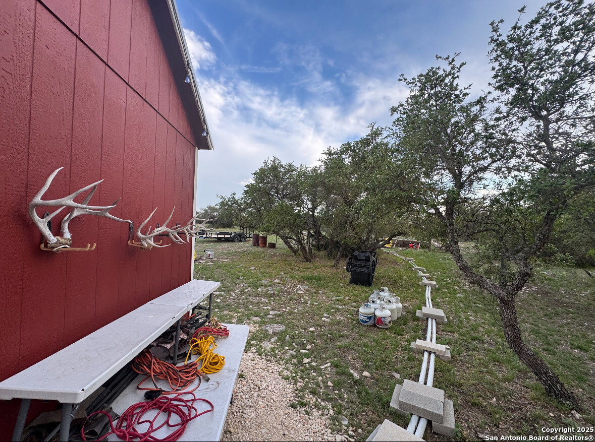 1085 Fallow Road Christoval, TX 76935 - Photo 26 of 26 a backyard of a house with table and chairs