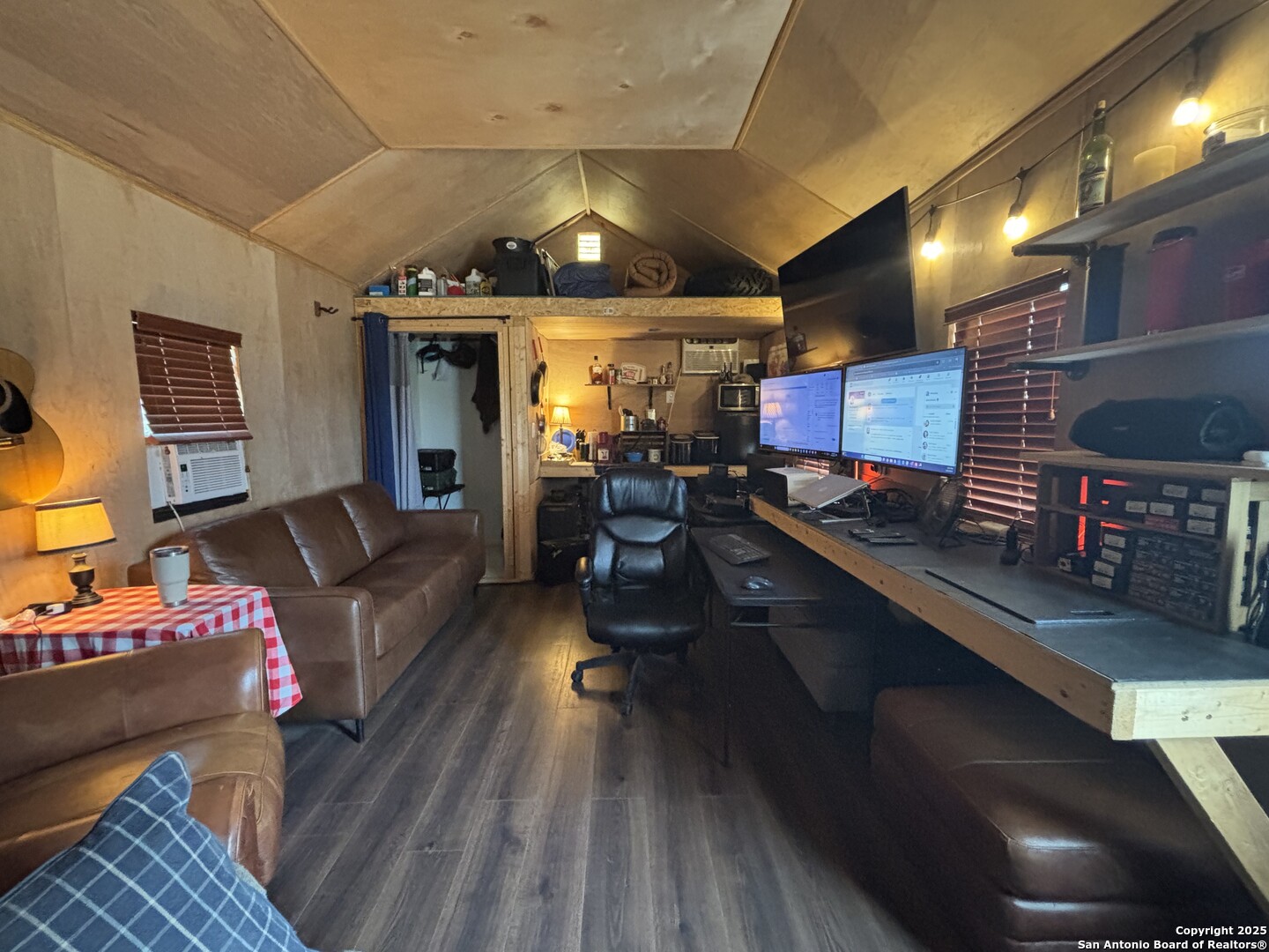 1085 Fallow Road Christoval, TX 76935 - Photo 7 of 26 a living room with furniture and a wooden floor
