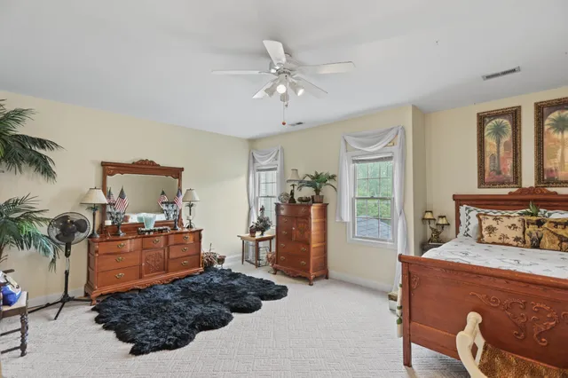 a view of a livingroom with furniture and a workspace
