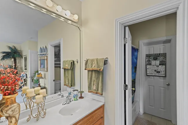 a room with pool table and stainless steel appliances