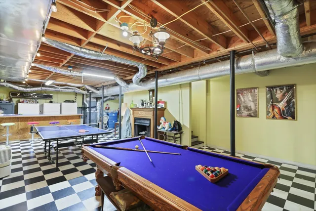 a view of a house with backyard sitting area and garden