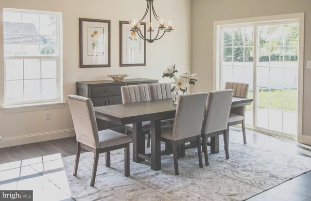 a bedroom with a bed and large window