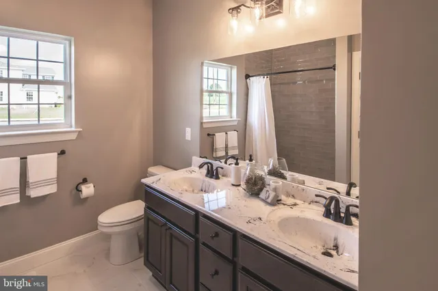 a bathroom with a shower and a window