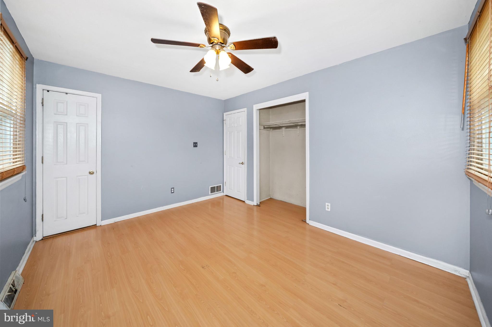 1023 Old Telegraph Road Warwick, MD 21912 - Photo 11 of 20 a view of a bedroom with a large bed and a chandelier fan