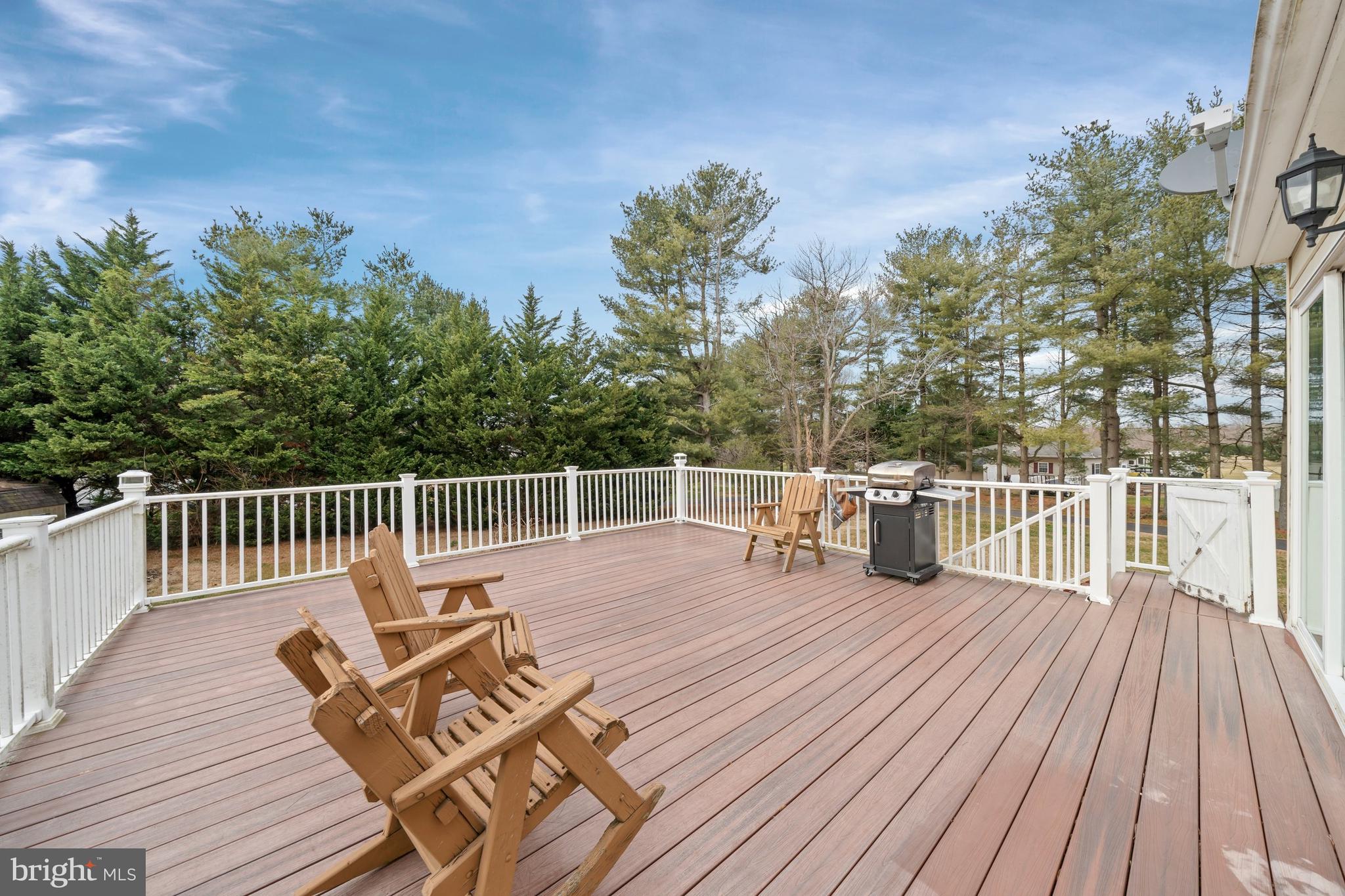 1023 Old Telegraph Road Warwick, MD 21912 - Photo 18 of 20 a balcony with wooden floor table and chairs