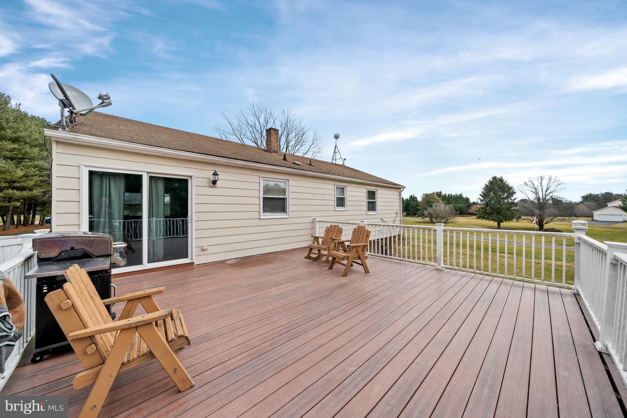 1023 Old Telegraph Road Warwick, MD 21912 - Photo 19 of 20 a view of a roof deck with wooden floor and outdoor seating