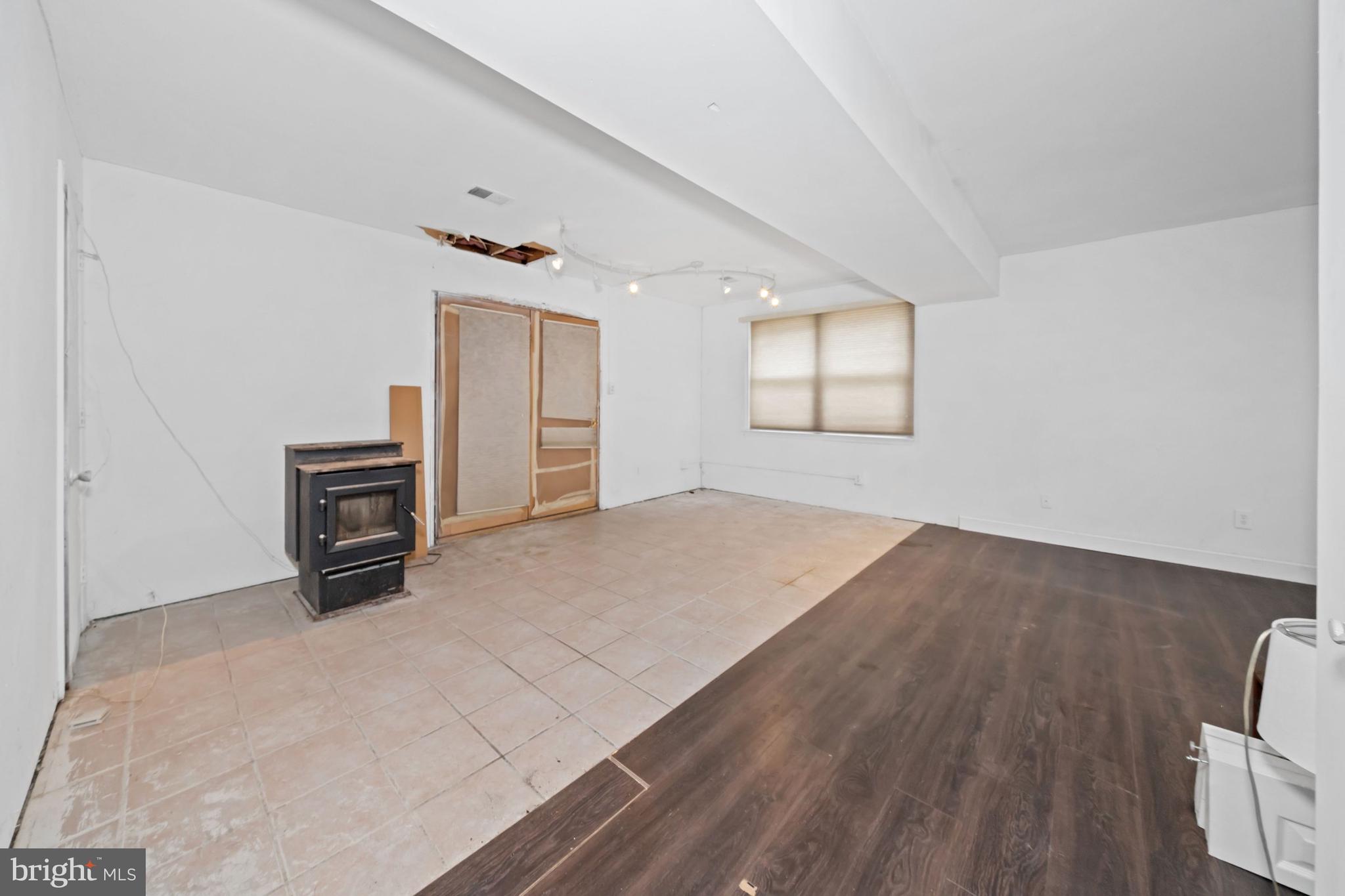 1023 Old Telegraph Road Warwick, MD 21912 - Photo 4 of 20 an empty room with windows and cabinet