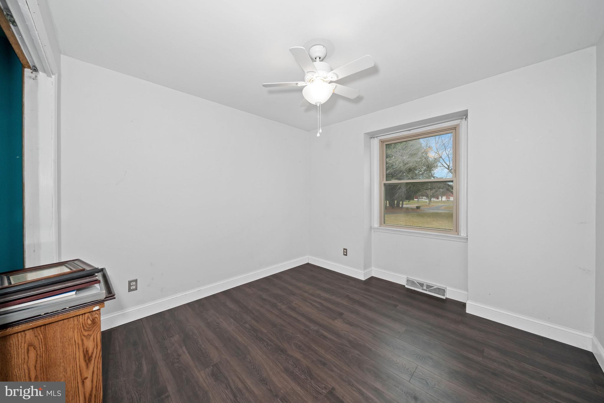 1023 Old Telegraph Road Warwick, MD 21912 - Photo 8 of 20 wooden floor in an empty room with a window