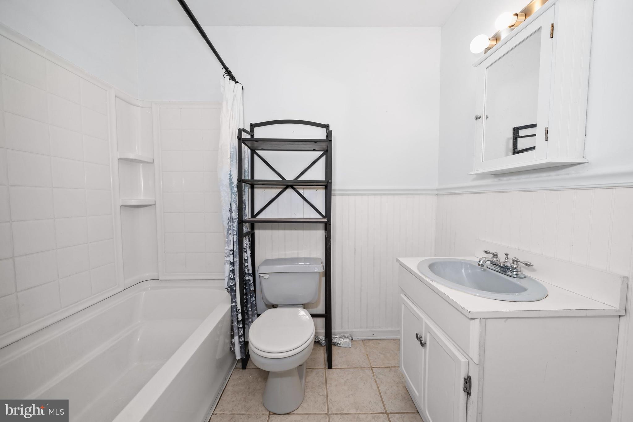 1023 Old Telegraph Road Warwick, MD 21912 - Photo 9 of 20 a bathroom with a sink a toilet and shower