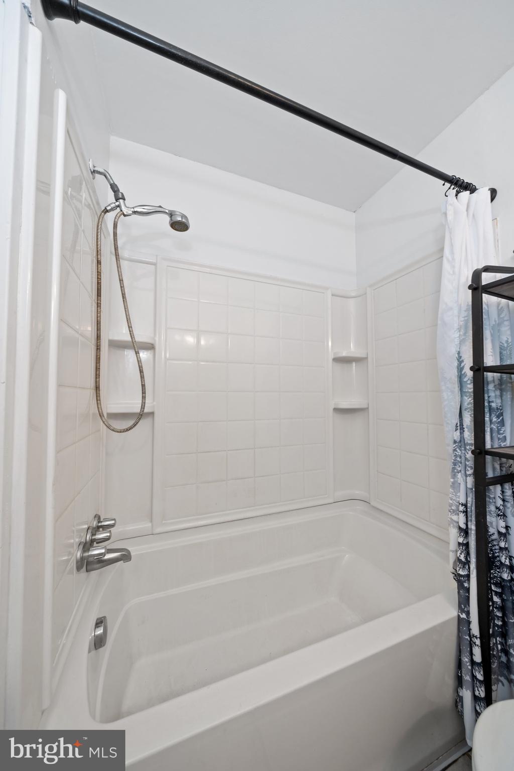 1023 Old Telegraph Road Warwick, MD 21912 - Photo 10 of 20 a bathroom with a shower and a bath tub