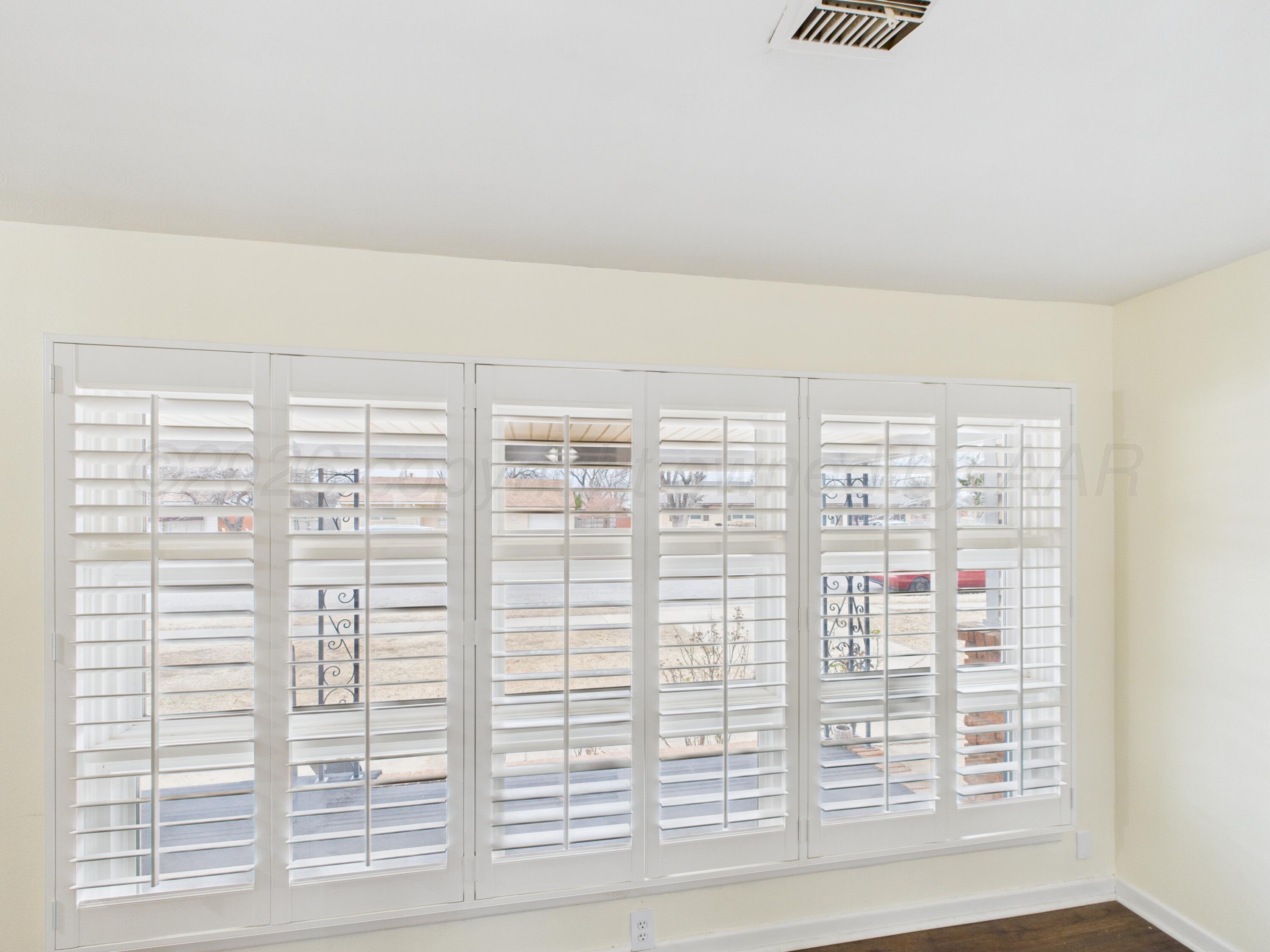 528 North Red Deer Street Pampa, TX 79065 - Photo 12 of 41 a view of wooden floor and windows in a room