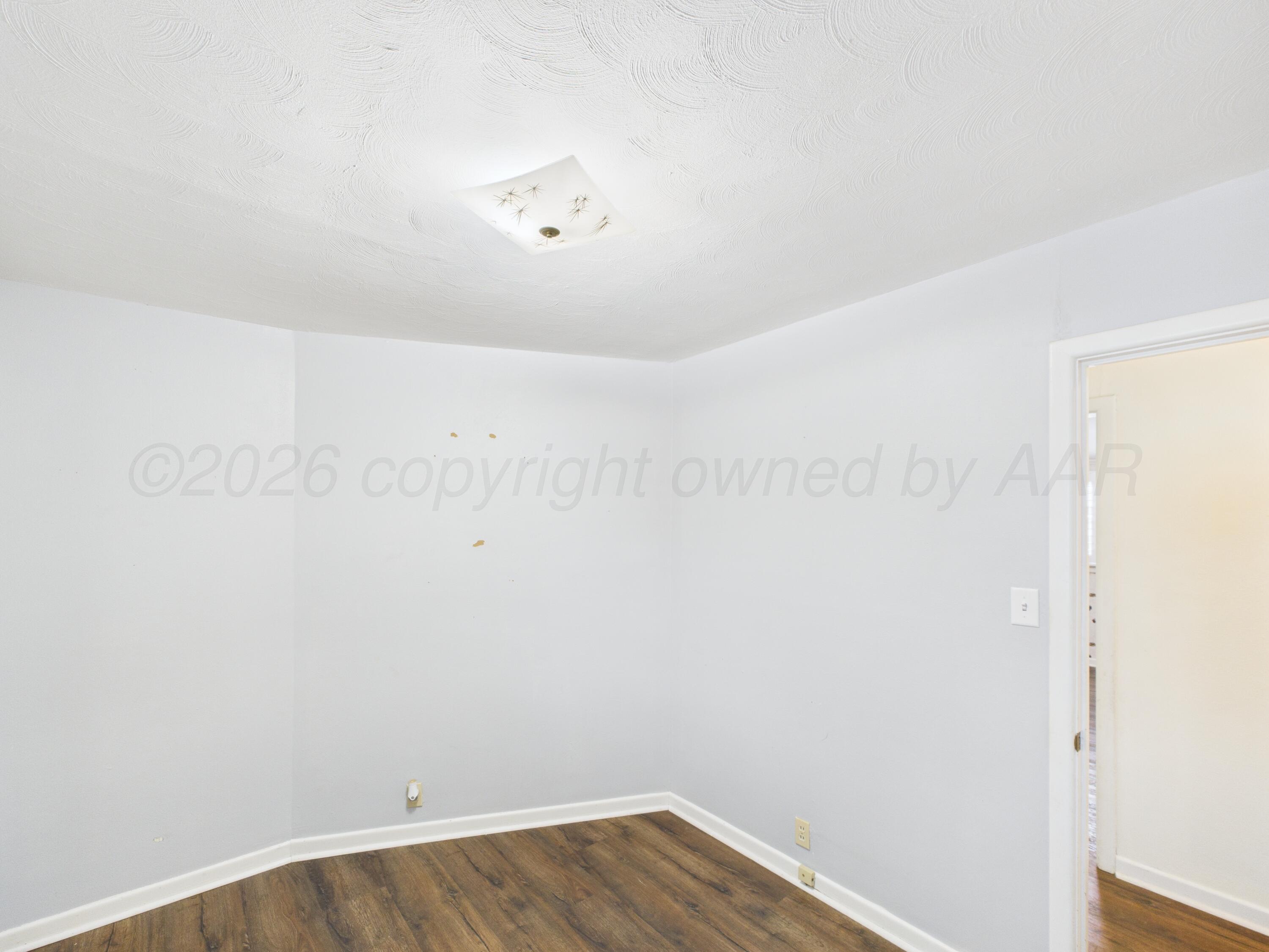 528 North Red Deer Street Pampa, TX 79065 - Photo 29 of 41 a view of a room with wooden floor