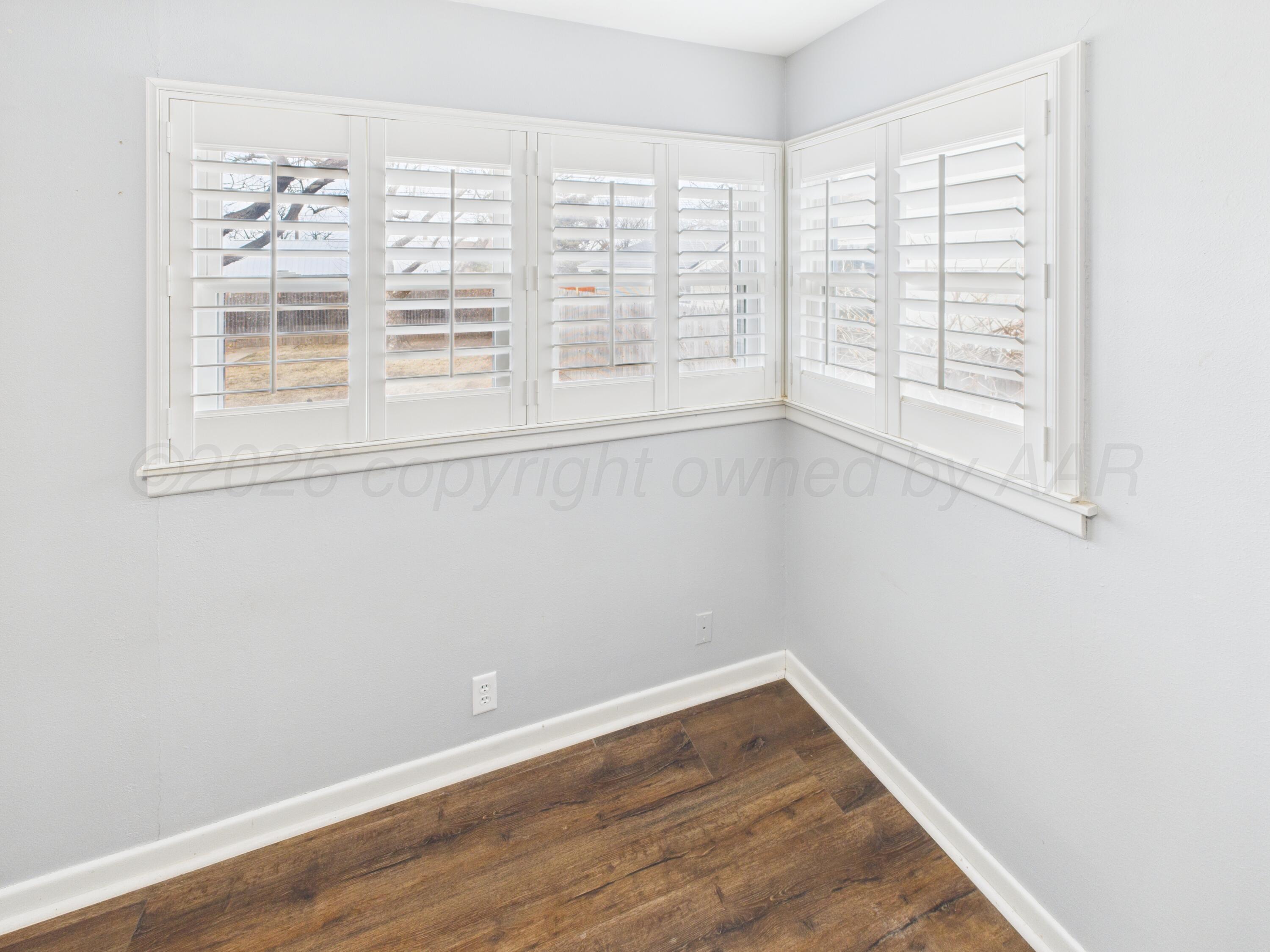528 North Red Deer Street Pampa, TX 79065 - Photo 35 of 41 wooden floor in an empty room with a window