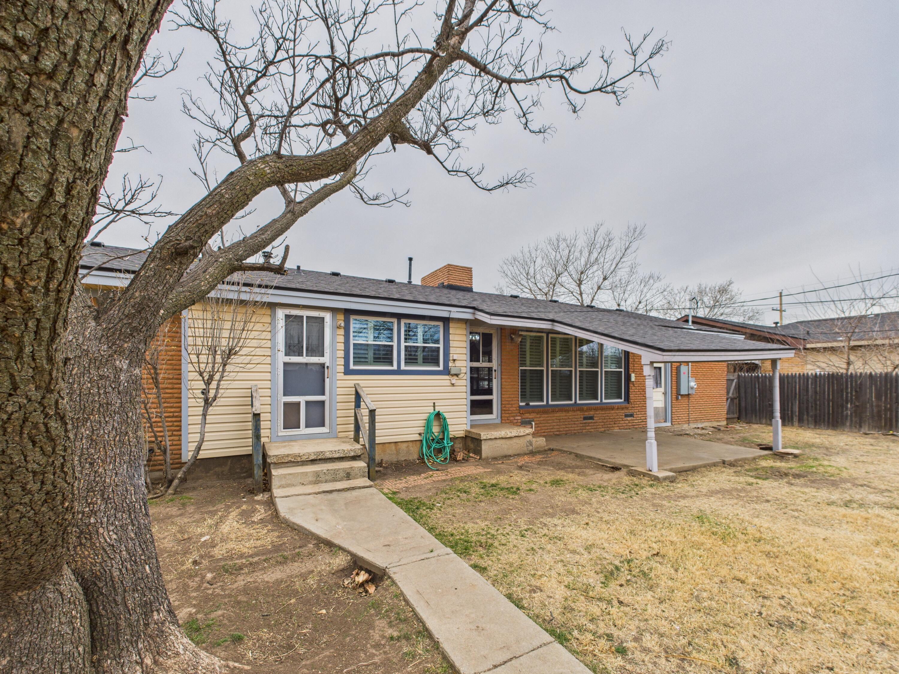 528 North Red Deer Street Pampa, TX 79065 - Photo 41 of 41 a front view of a house with a yard covered in snow