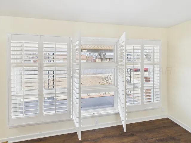 a view of a room with a large window