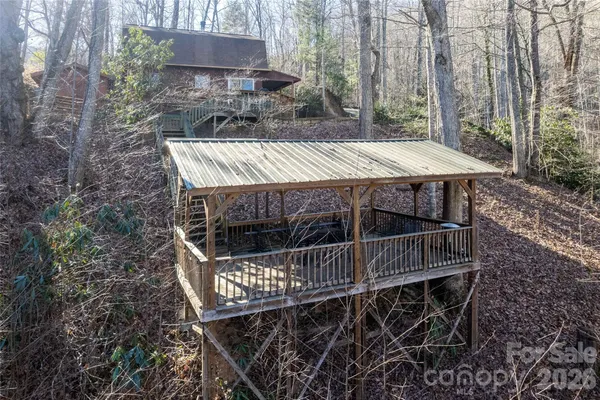 a view of a roof with wooden deck