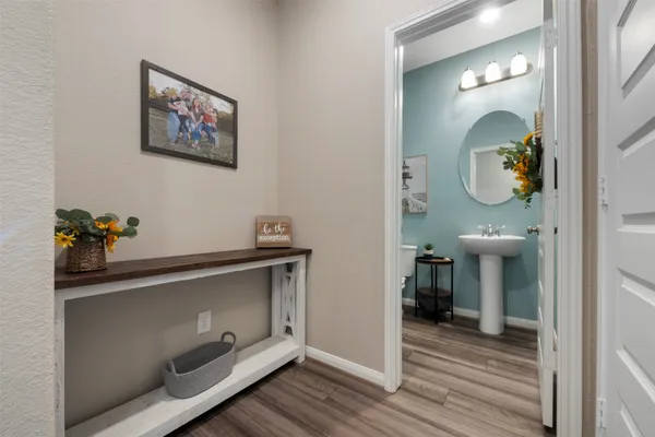 a view of a room with wooden floor and cabinet