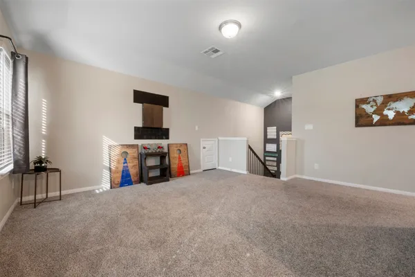 a view of a porch with chairs and couches