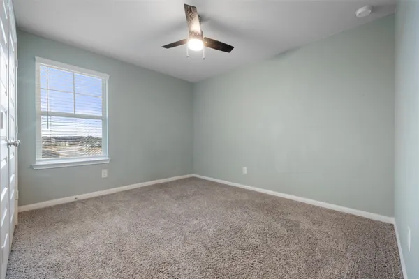 a front view of a house with a yard garage and outdoor seating